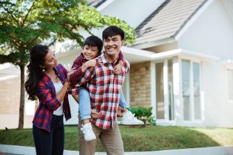 Family walking in front of a home.